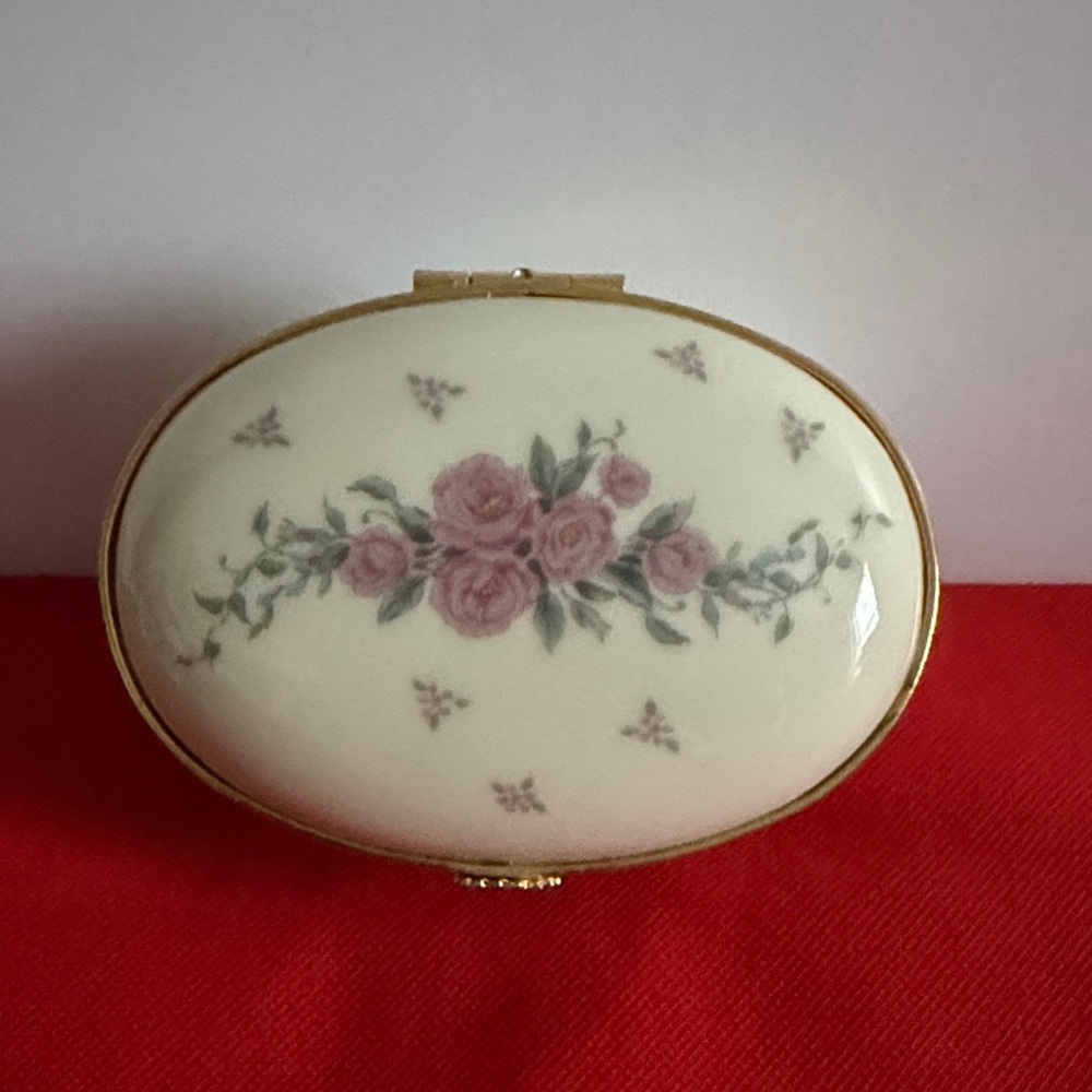 Floral Oval Trinket with Gold Accents. 3 inches long by 2.25 inches wide.
